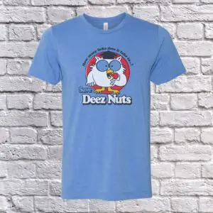 A blue t-shirt with a cartoon owl, How Many Licks?, on it.